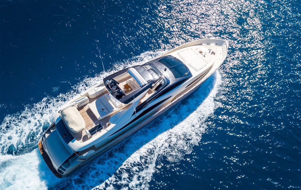 aerial shot of a yacht sailing on the sea